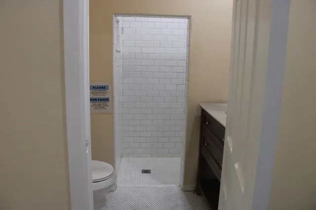 a bathroom with a sink a mirror and a shower