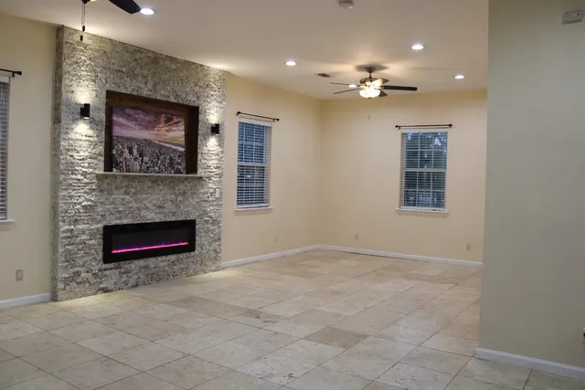 hallway with wooden floor and bathroom
