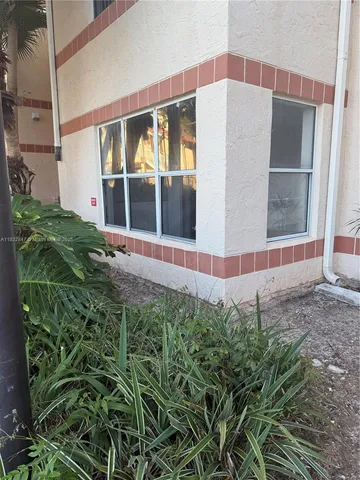 a view of a backyard of the house