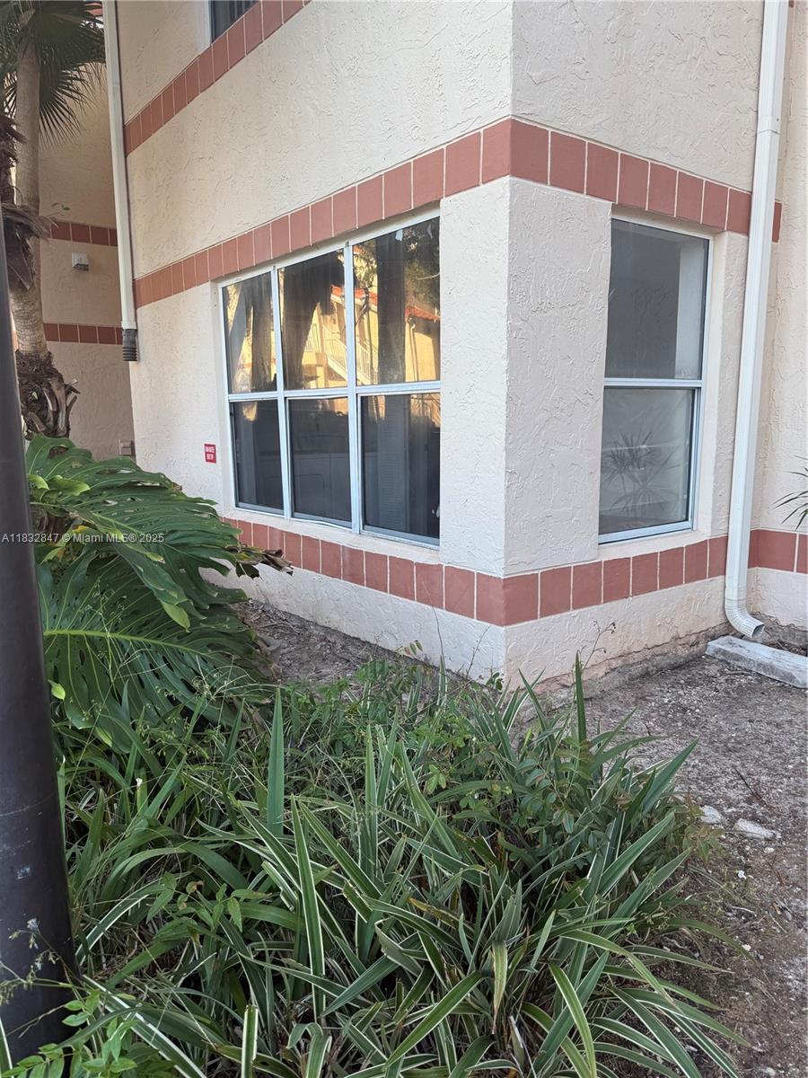 3320 Pinewalk Drive North, Unit 1715 Margate, FL 33063 - Photo 1 of 35 a view of a backyard of the house