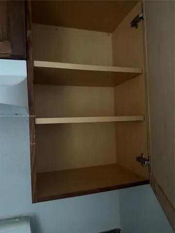 a white refrigerator freezer sitting inside of a kitchen