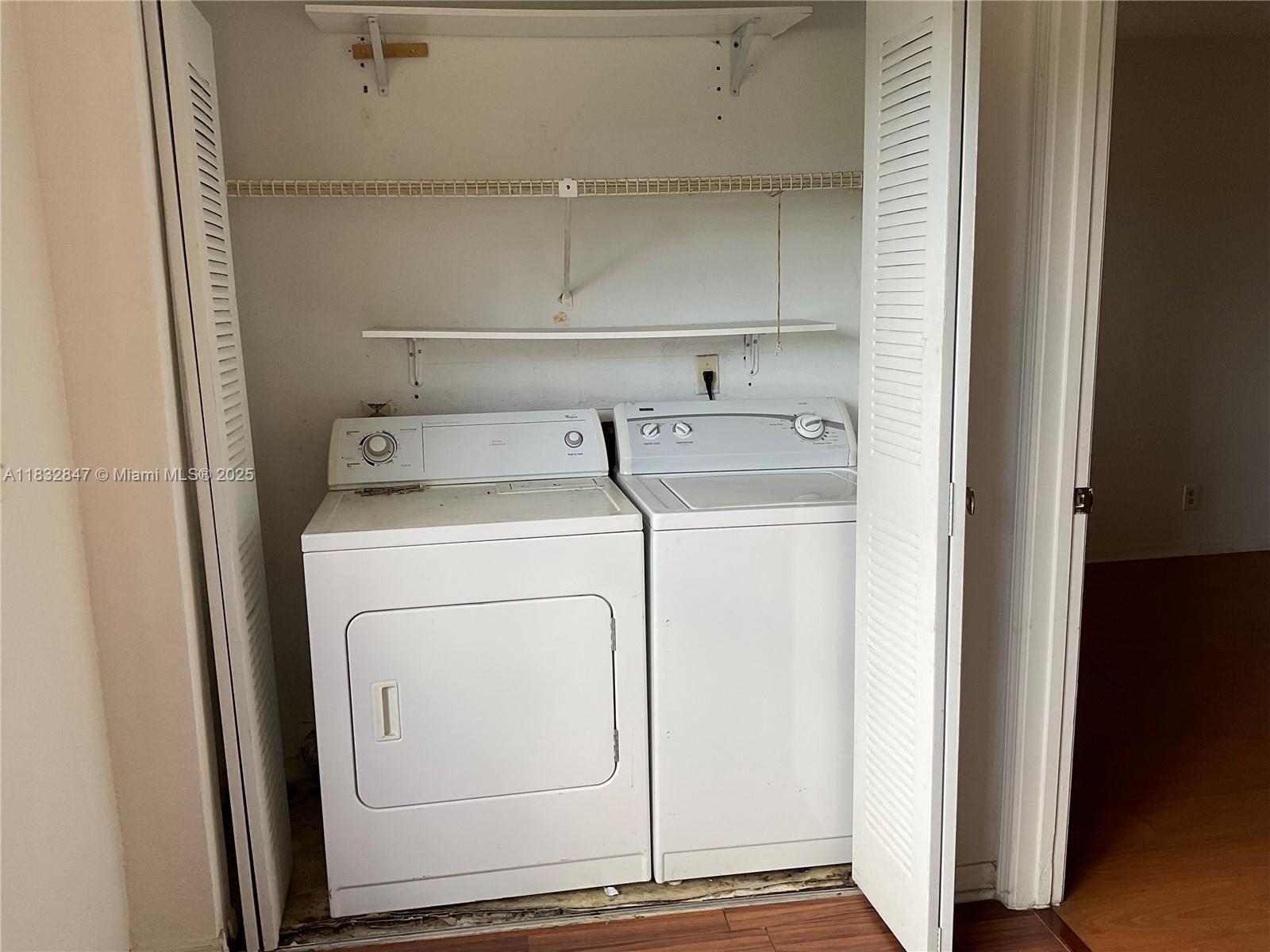 3320 Pinewalk Drive North, Unit 1715 Margate, FL 33063 - Photo 21 of 35 a utility room with dryer and washer