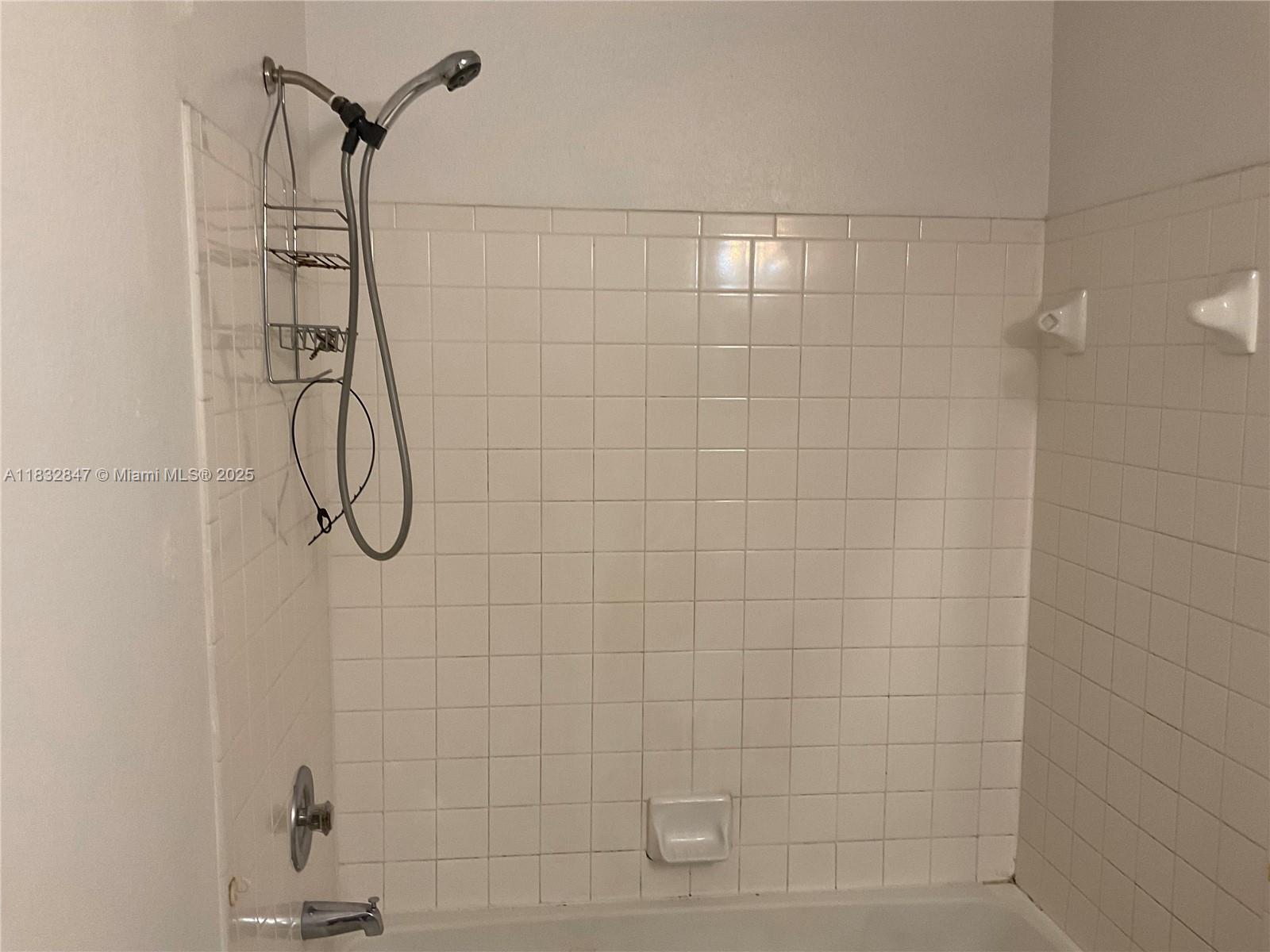 3320 Pinewalk Drive North, Unit 1715 Margate, FL 33063 - Photo 22 of 35 a bathroom with a shower