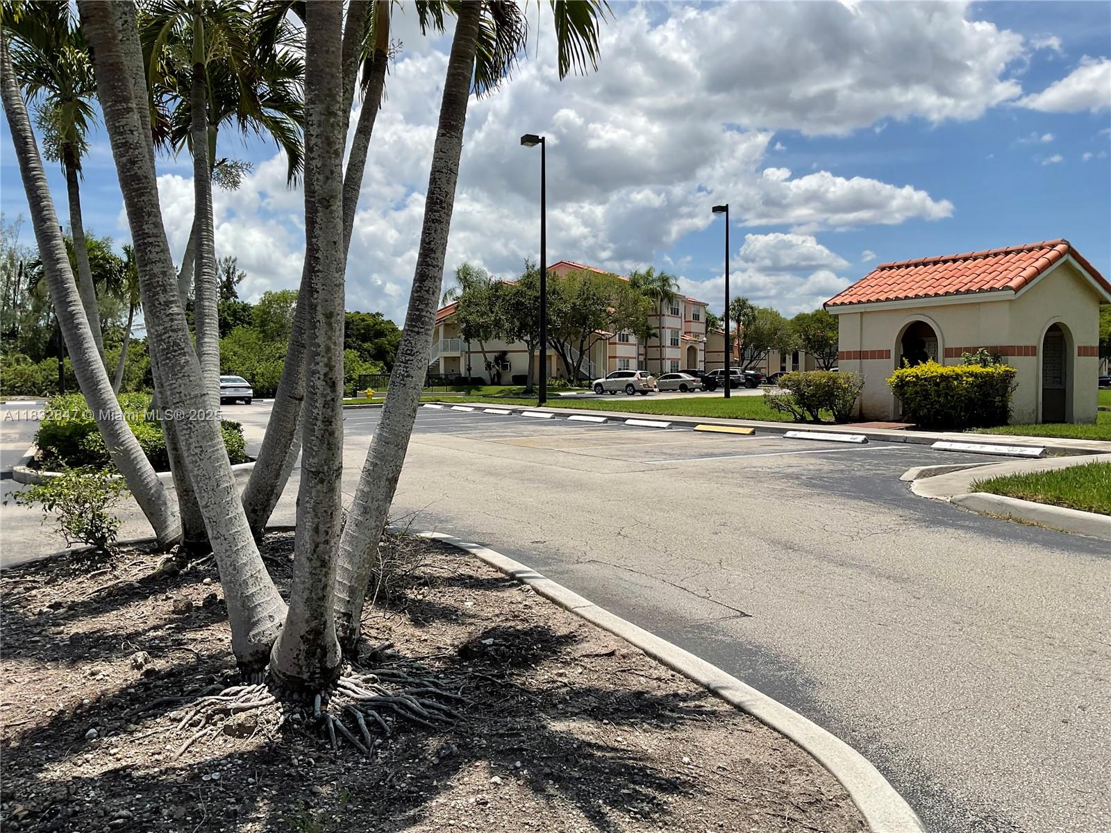 3320 Pinewalk Drive North, Unit 1715 Margate, FL 33063 - Photo 3 of 35 a view of a basketball court