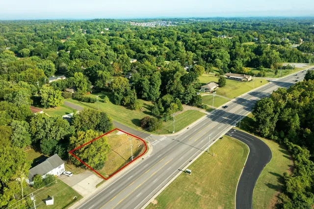 a view of a swimming pool with a yard