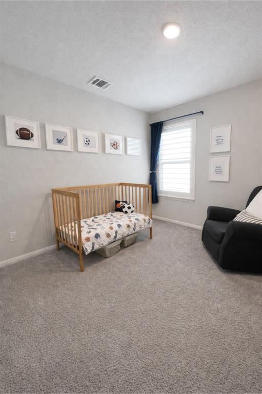 6609 Adderly Road Pilot Point, TX 76258 - Photo 12 of 15 a bedroom with a bed and a couch