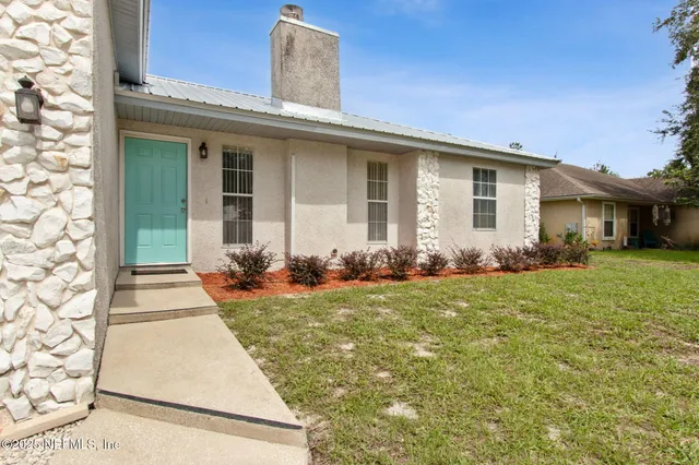 front view of a house with a yard
