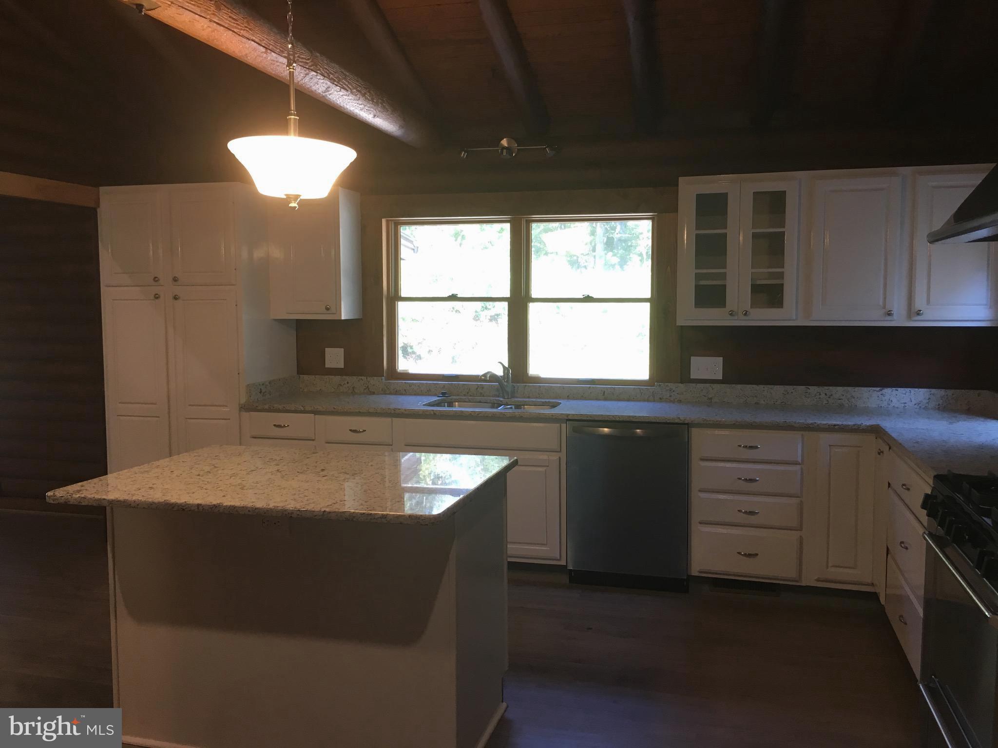 6157 Wilson Road Marshall, VA 20115 - Photo 14 of 35 a kitchen with a sink stove and cabinets