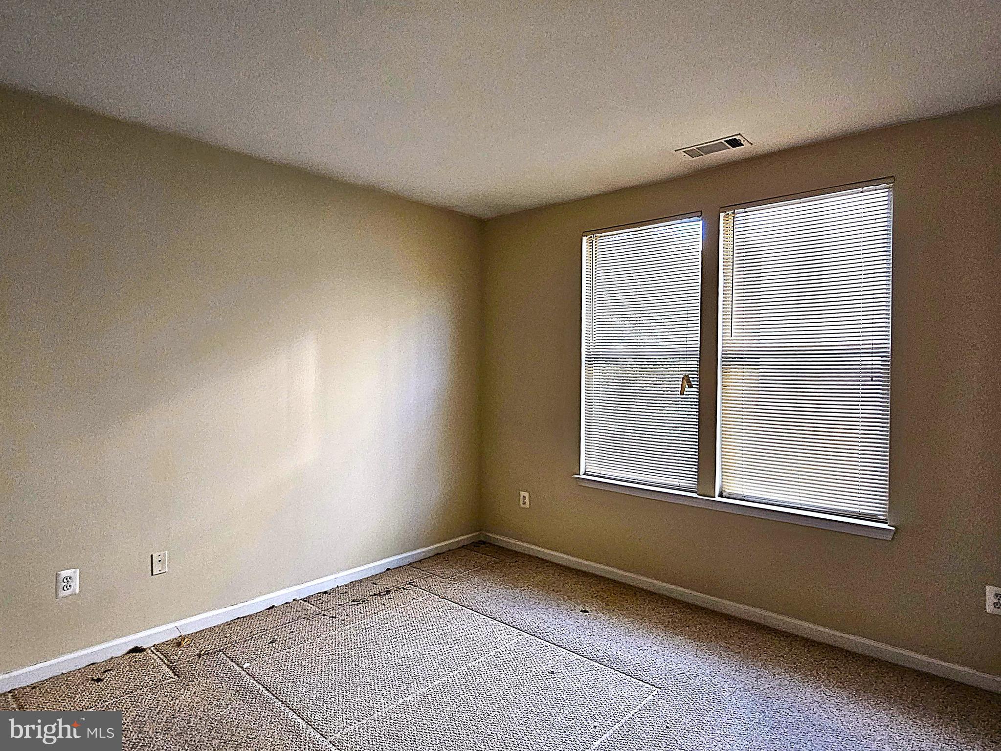 12000 Market Street, Unit 283 Reston, VA 20190 - Photo 11 of 36 an empty room with a window