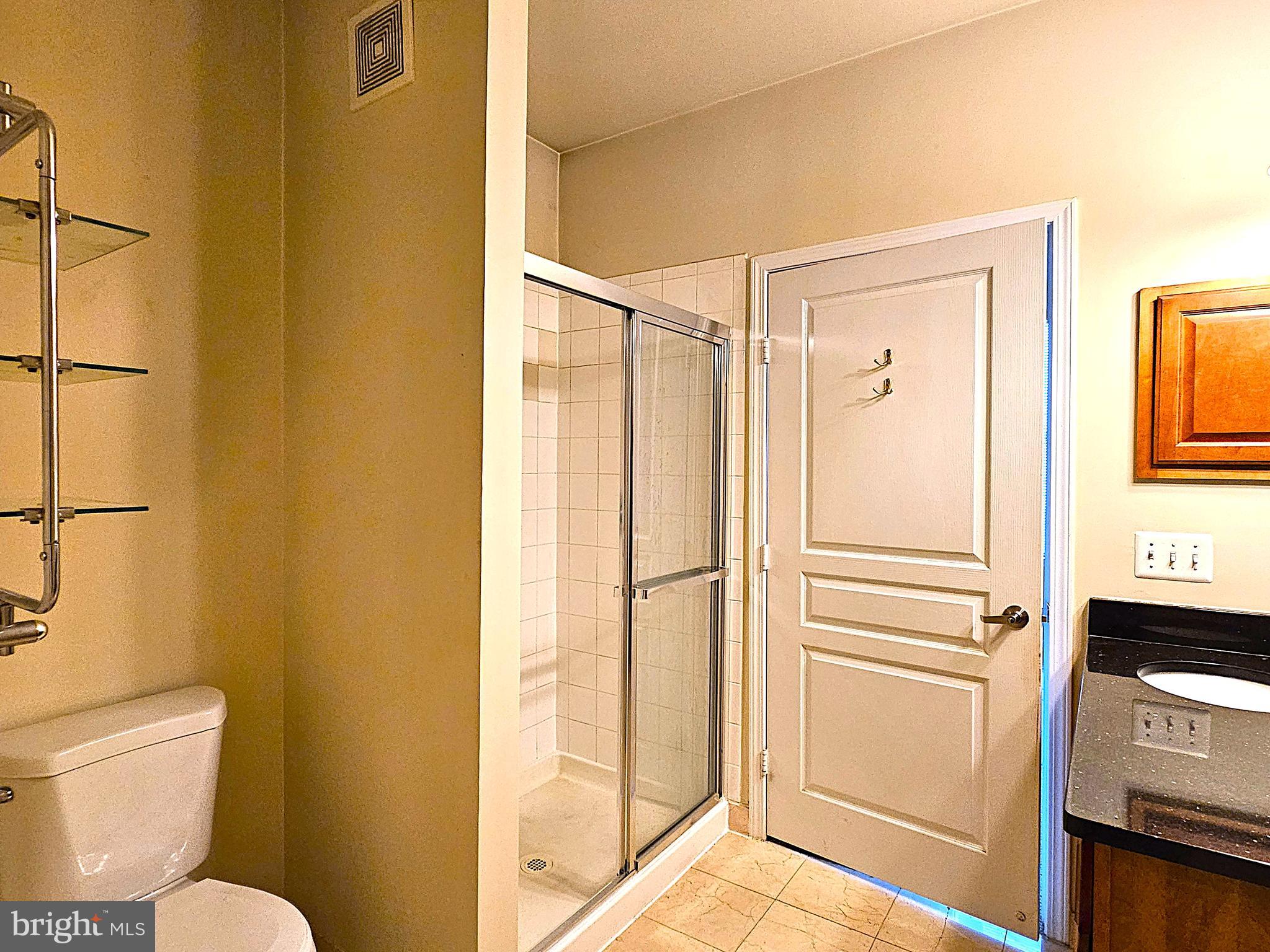 12000 Market Street, Unit 283 Reston, VA 20190 - Photo 14 of 36 a bathroom with a shower toilet and sink