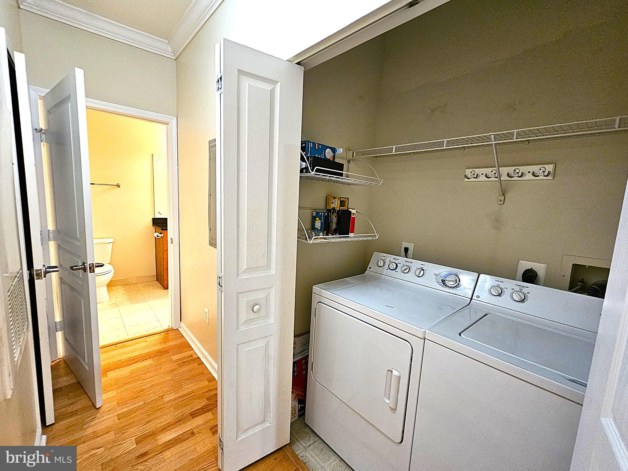 12000 Market Street, Unit 283 Reston, VA 20190 - Photo 25 of 36 a view of storage and utility room with washer and dryer