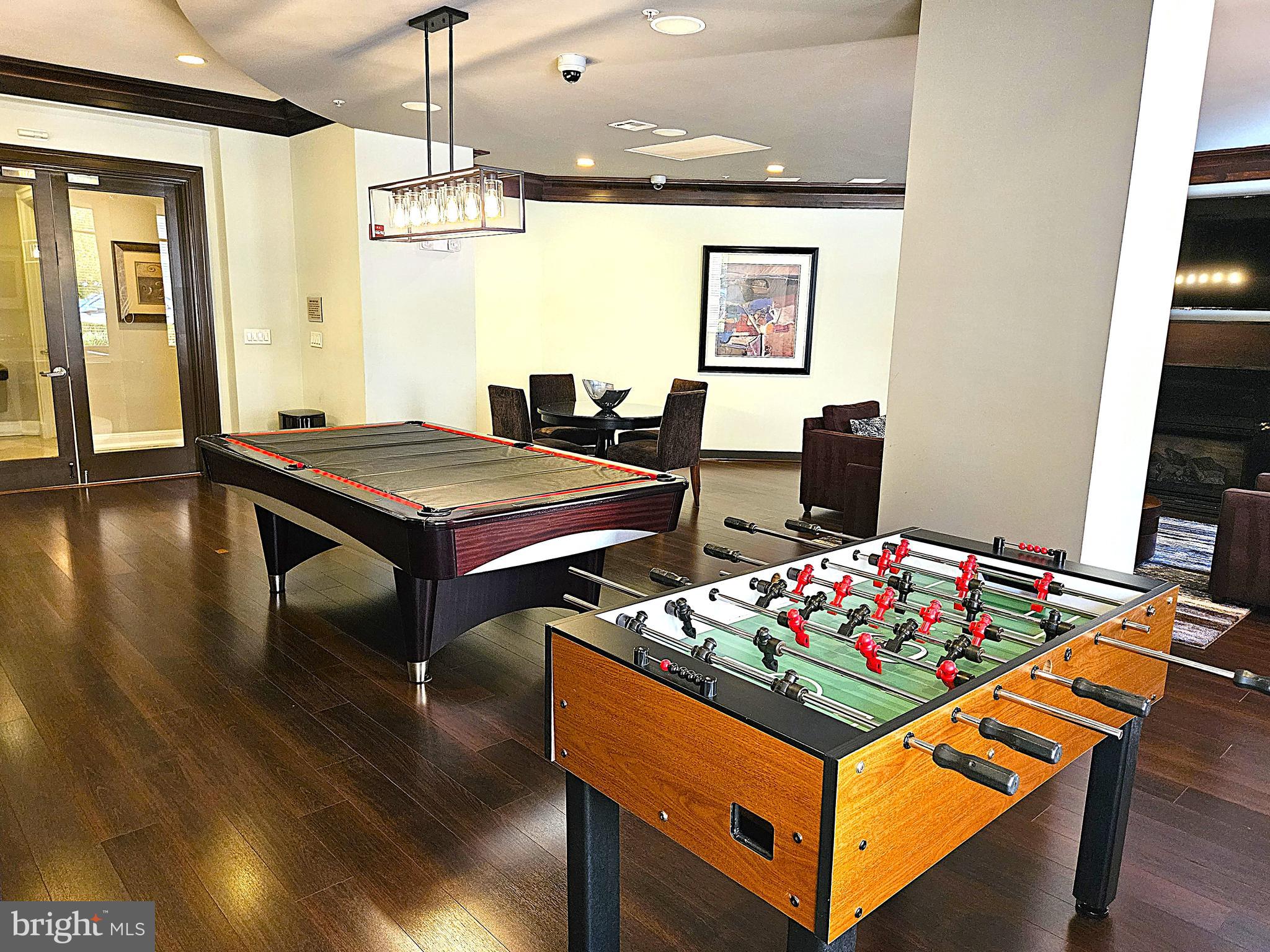 12000 Market Street, Unit 283 Reston, VA 20190 - Photo 29 of 36 a living room with furniture and a table