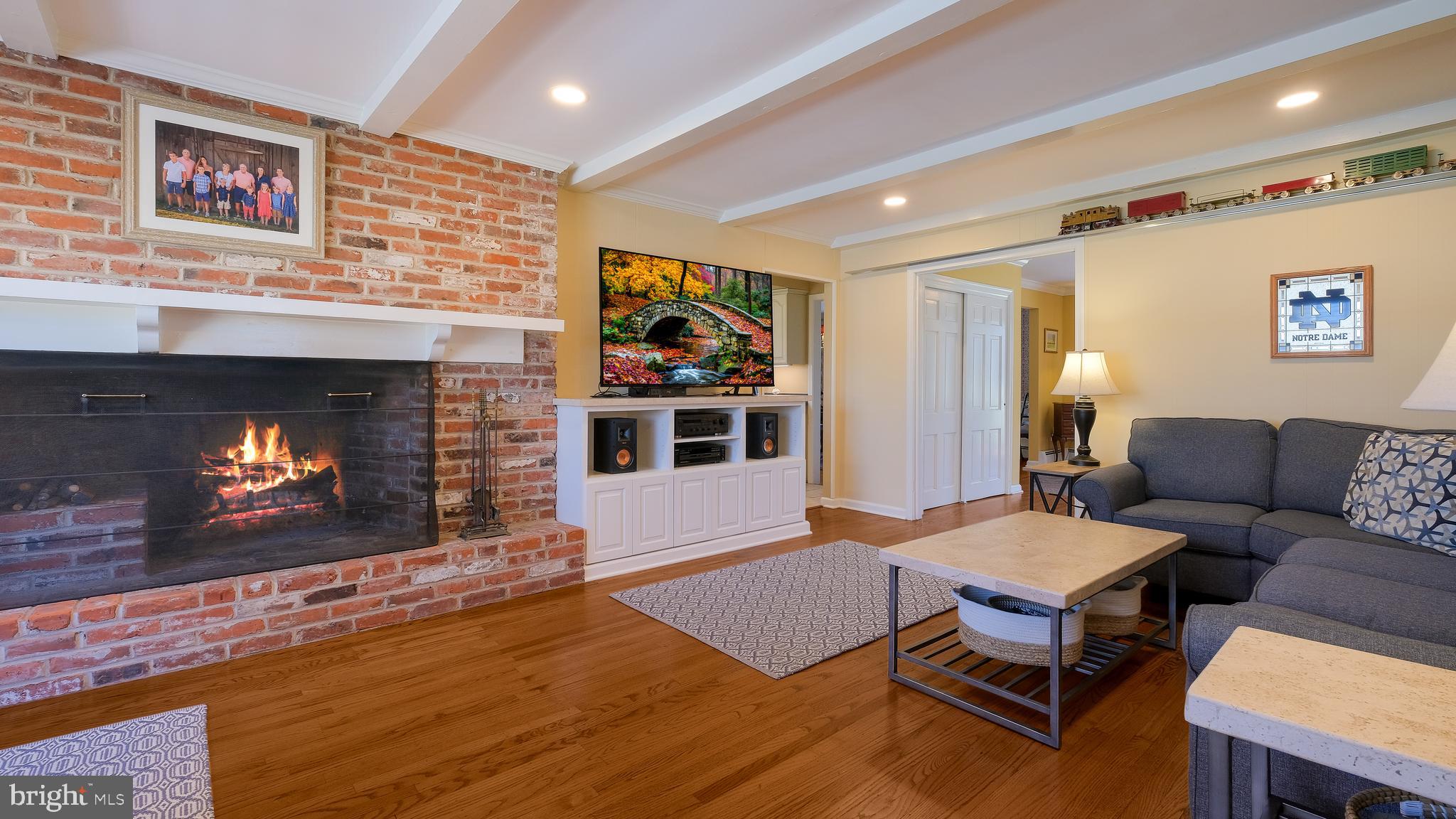 12 Pine Valley Road Doylestown, PA 18901 - Photo 23 of 63 a living room with furniture a flat screen tv and a fireplace