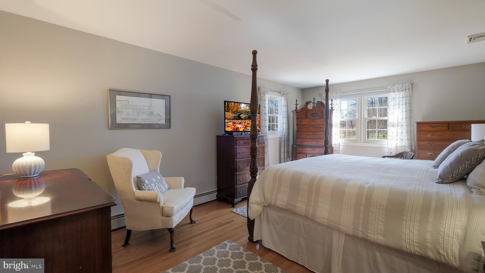 12 Pine Valley Road Doylestown, PA 18901 - Photo 27 of 63 a bedroom with a bed and wooden floor