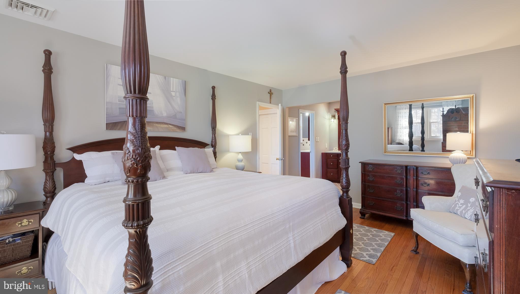 12 Pine Valley Road Doylestown, PA 18901 - Photo 28 of 63 a bedroom with a bed a mirror and desk