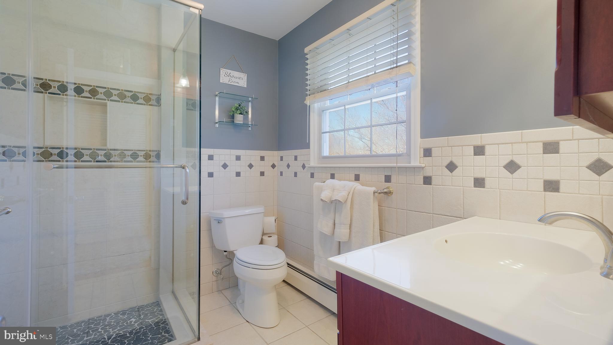 12 Pine Valley Road Doylestown, PA 18901 - Photo 31 of 63 a bathroom with a sink a toilet and shower