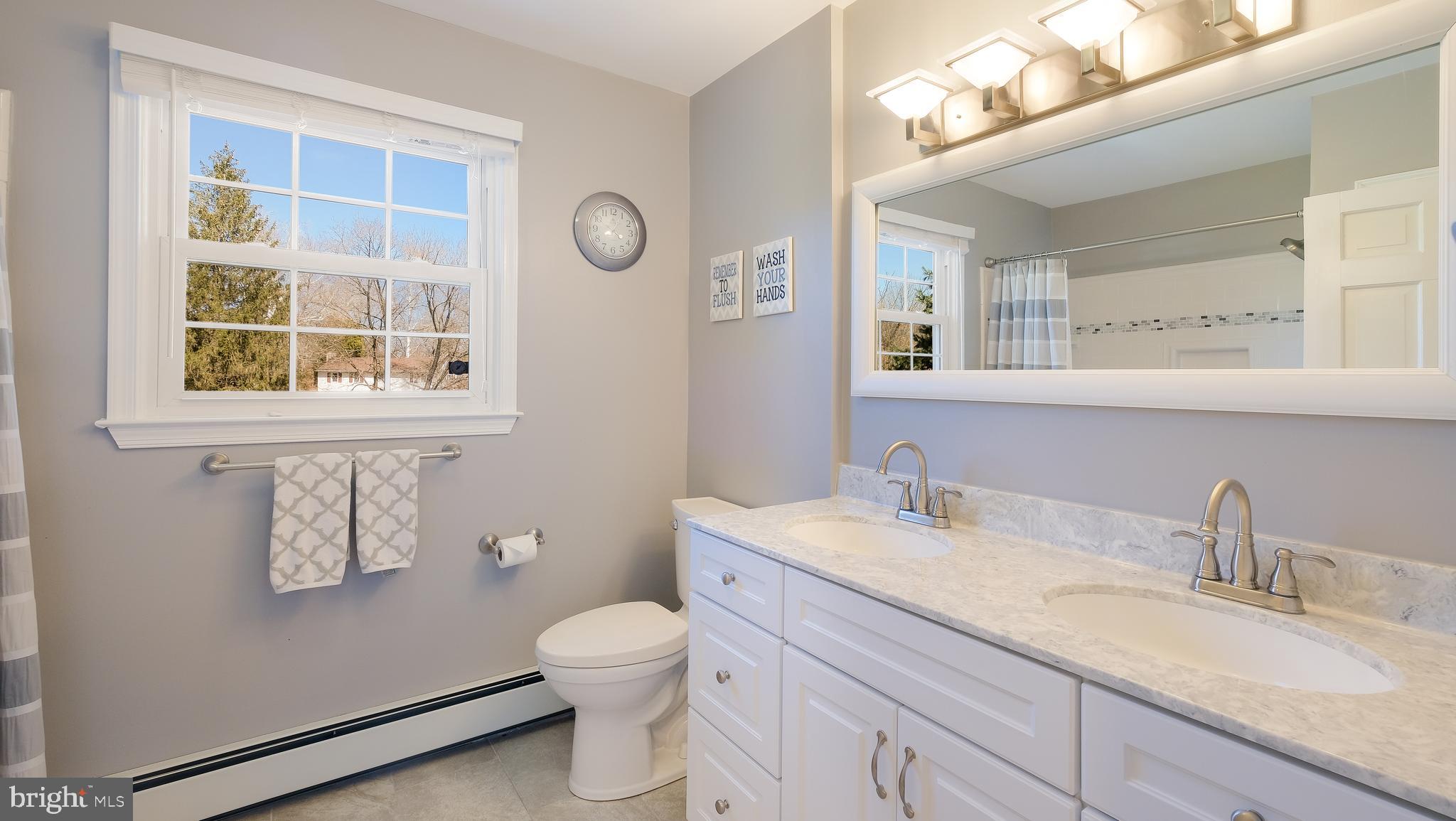 12 Pine Valley Road Doylestown, PA 18901 - Photo 35 of 63 a bathroom with a granite countertop sink mirror vanity and toilet