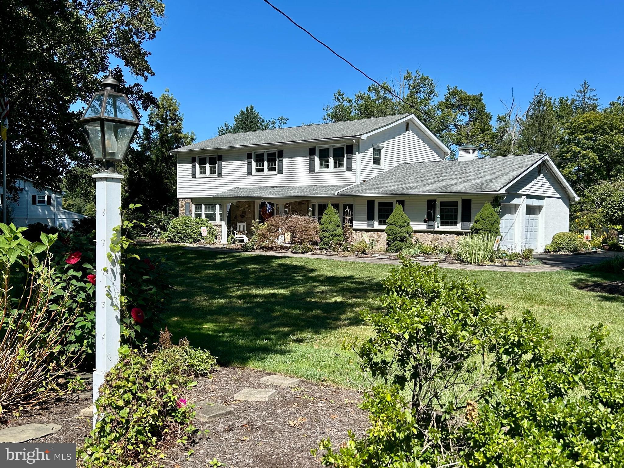 12 Pine Valley Road Doylestown, PA 18901 - Photo 52 of 63 a front view of a house with garden