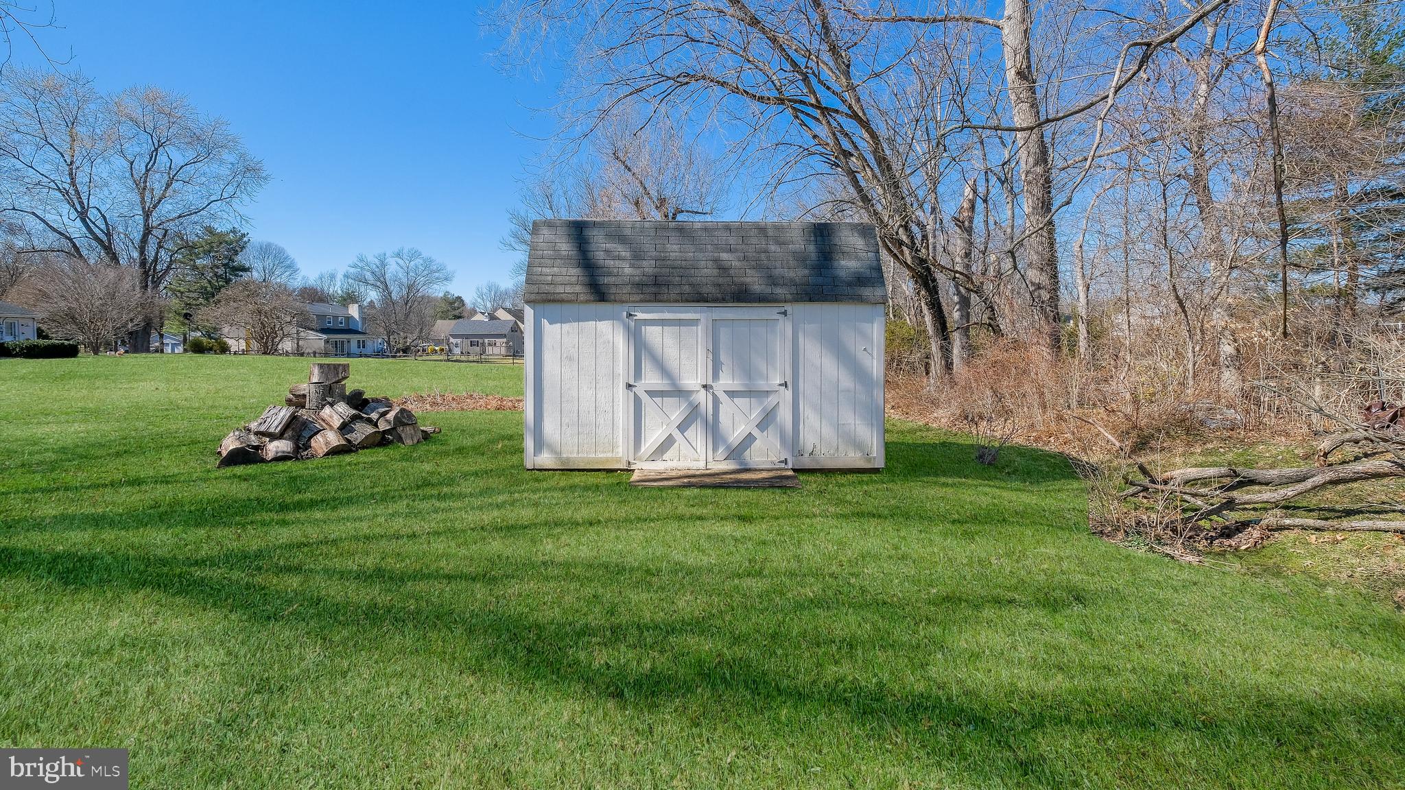 12 Pine Valley Road Doylestown, PA 18901 - Photo 55 of 63 a backyard of a house with lots of green space