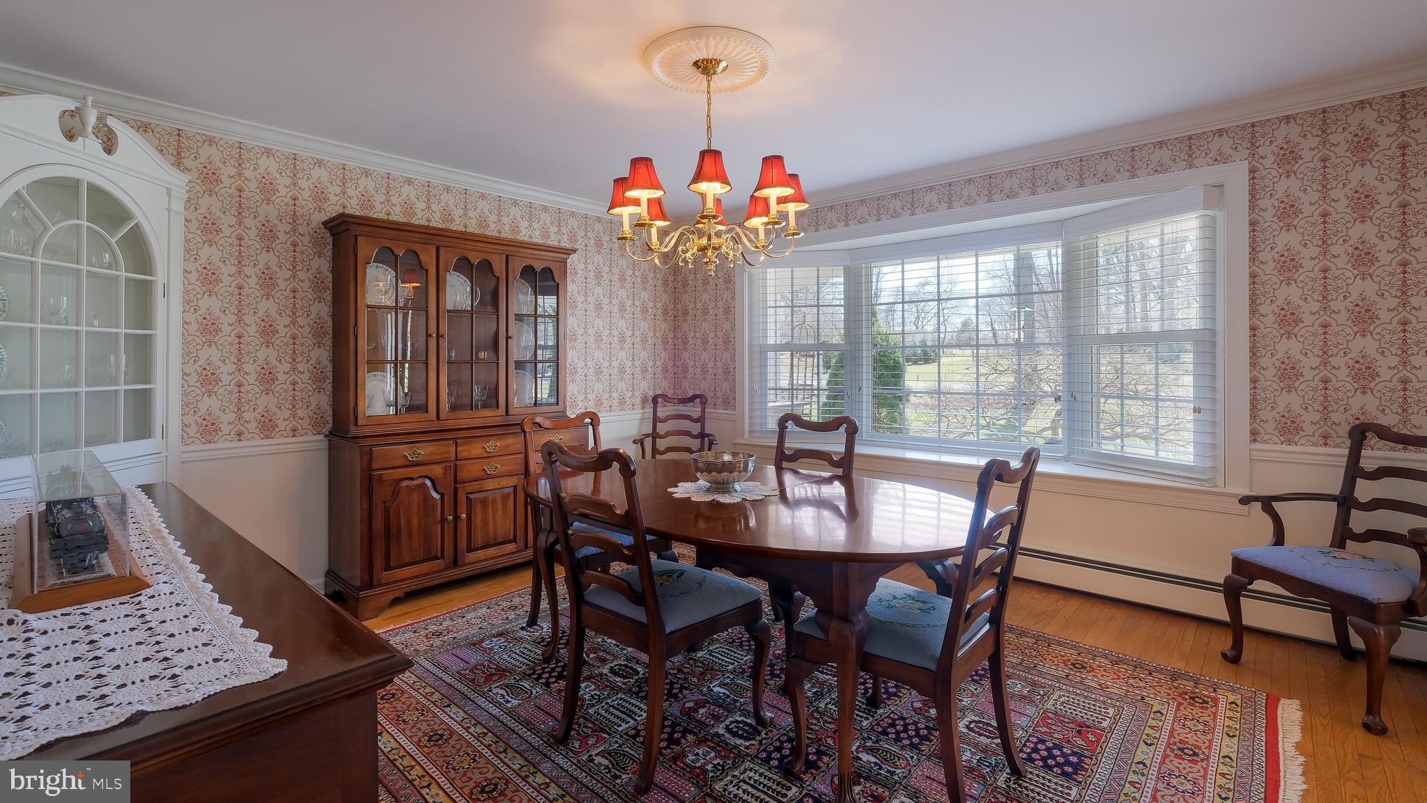 12 Pine Valley Road Doylestown, PA 18901 - Photo 8 of 63 a view of a dining room with furniture and a chandelier