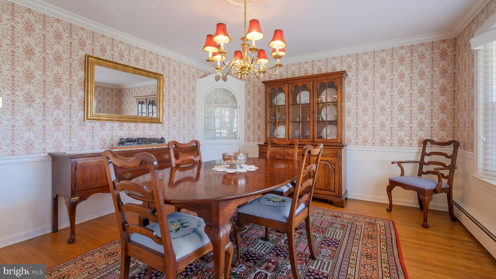 12 Pine Valley Road Doylestown, PA 18901 - Photo 9 of 63 a view of a dining room with furniture and wooden floor