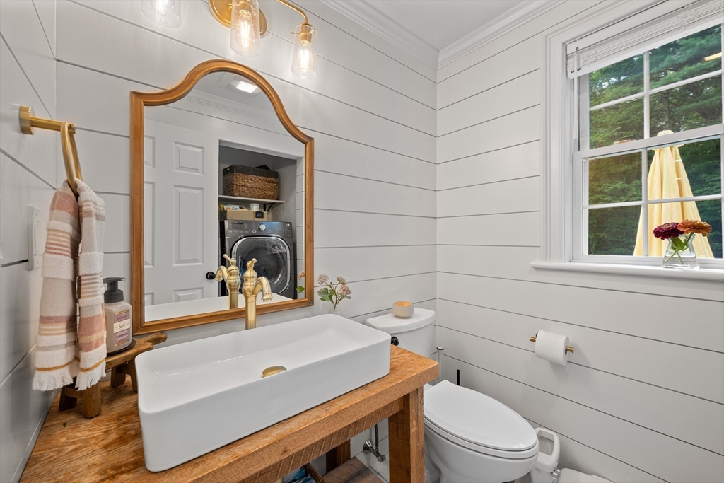 8 Virginia Avenue Sutton, MA 01590 - Photo 12 of 42 a bathroom with a sink a toilet and a mirror