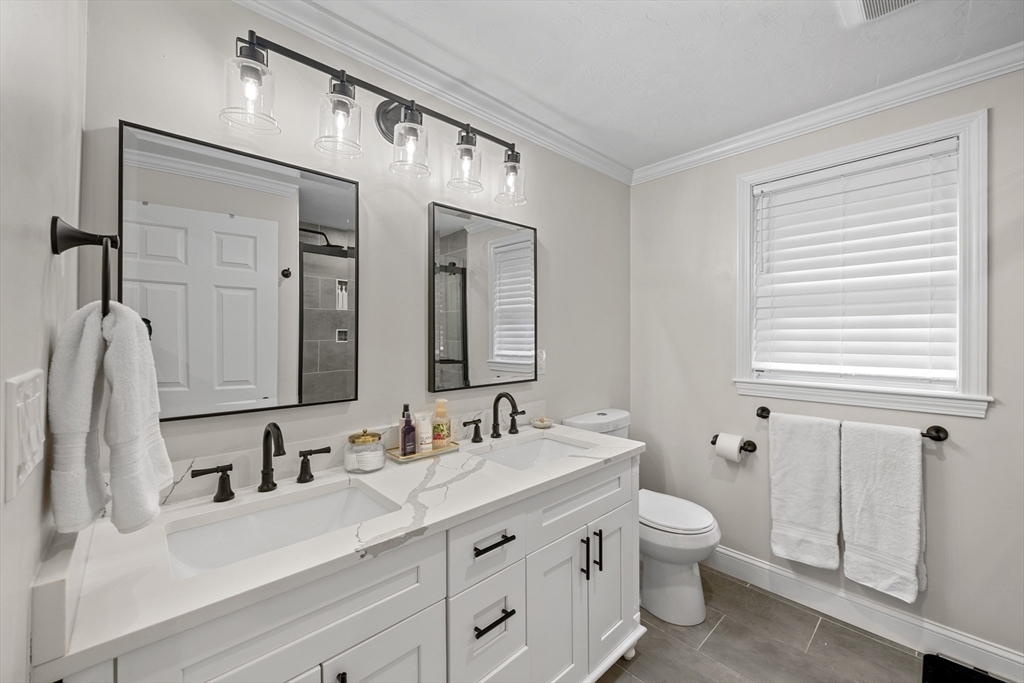 8 Virginia Avenue Sutton, MA 01590 - Photo 19 of 42 a bathroom with a double vanity sink mirror and toilet