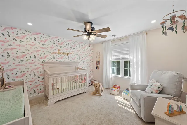 a bedroom with furniture and a window