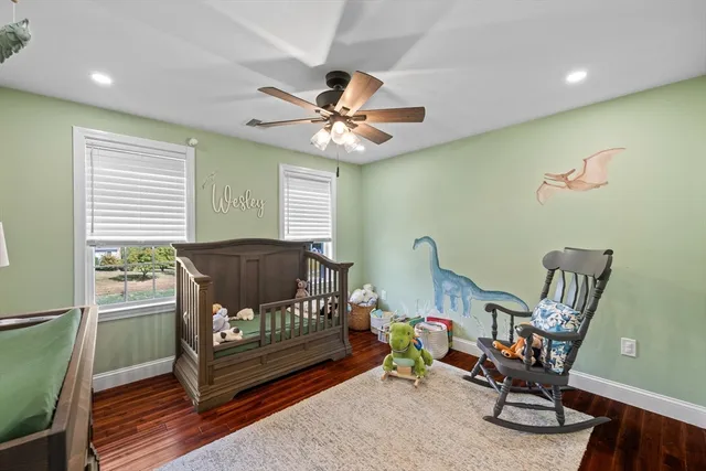 a bedroom with furniture and a window