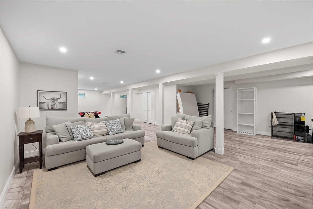 8 Virginia Avenue Sutton, MA 01590 - Photo 27 of 42 a living room with furniture and a wooden floor