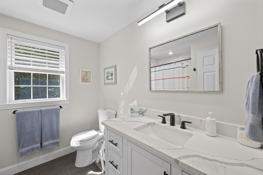 8 Virginia Avenue Sutton, MA 01590 - Photo 31 of 42 a bathroom with a sink toilet and mirror