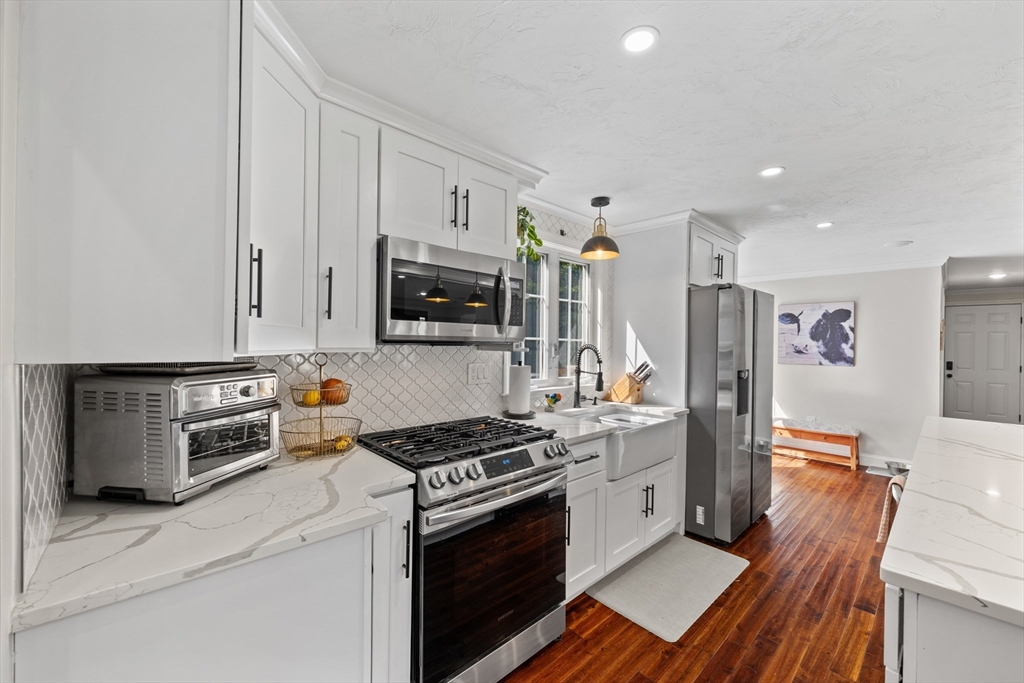 8 Virginia Avenue Sutton, MA 01590 - Photo 8 of 42 a kitchen with stainless steel appliances a stove a refrigerator and a cabinets