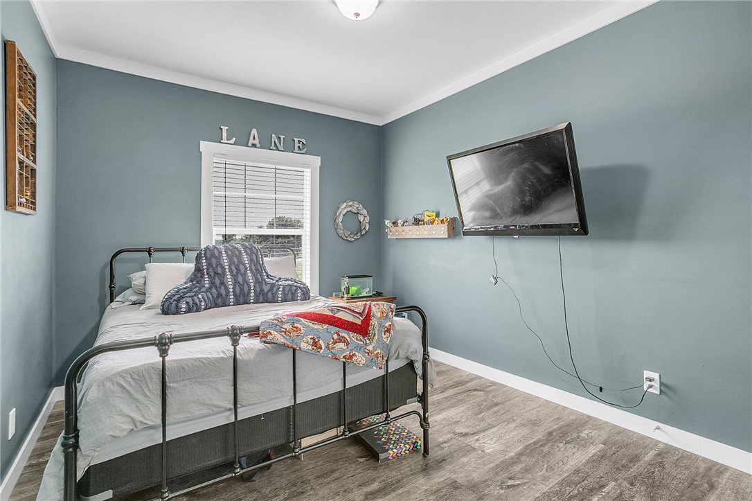 615 Wilson Road Central, SC 29630 - Photo 20 of 50 Rich wood-look flooring and crisp crown molding highlight this cozy private retreat.