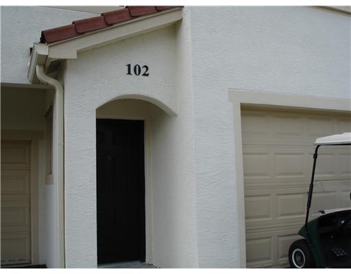 102 Southeast Hancock Street, Unit 102 Stuart, FL 34994 - Photo 1 of 6 a front view of a house