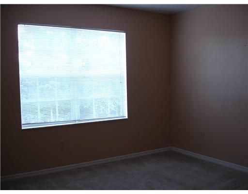 102 Southeast Hancock Street, Unit 102 Stuart, FL 34994 - Photo 4 of 6 a view of an empty room with a window