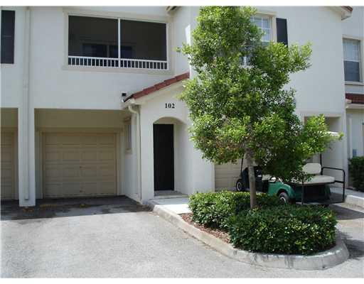 102 Southeast Hancock Street, Unit 102 Stuart, FL 34994 - Photo 6 of 6 a front view of a house with plants