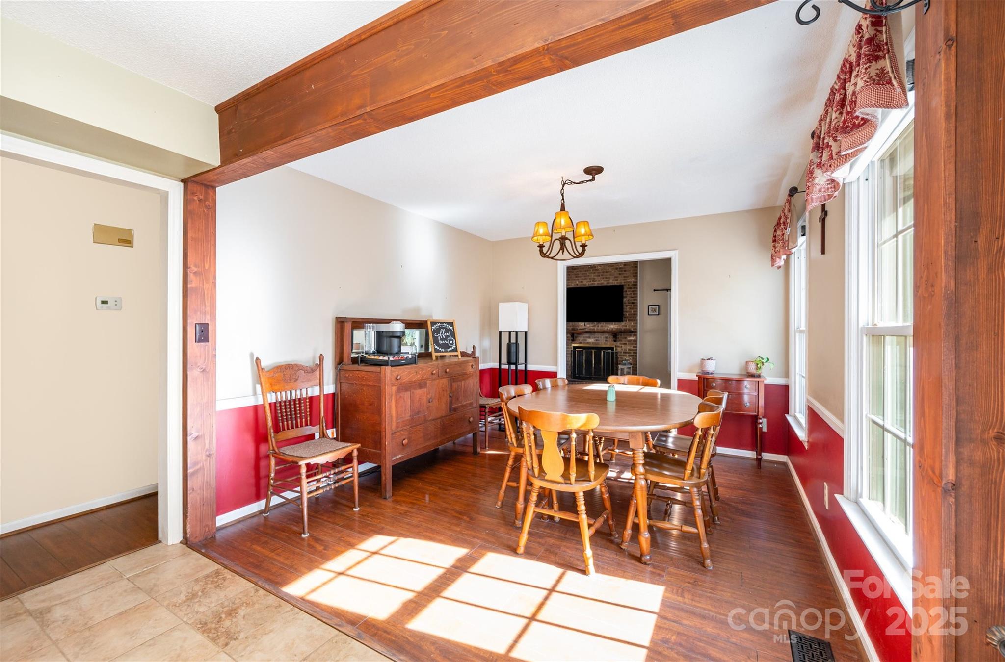 302 Nottingham Way Wadesboro, NC 28170 - Photo 21 of 30 a dining room with furniture a rug and a chandelier