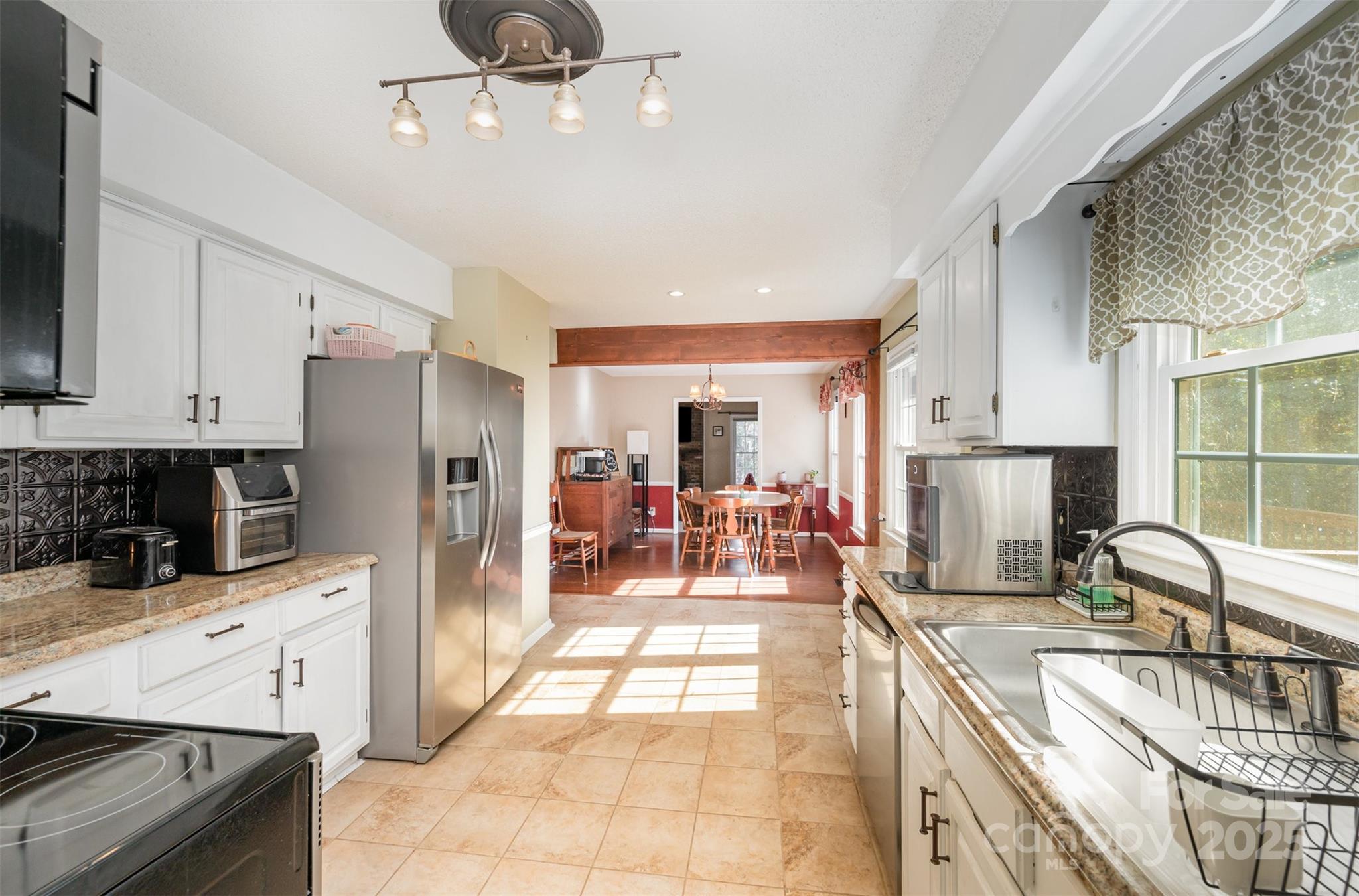 302 Nottingham Way Wadesboro, NC 28170 - Photo 22 of 30 a kitchen with stainless steel appliances granite countertop a sink counter space cabinets and a stove