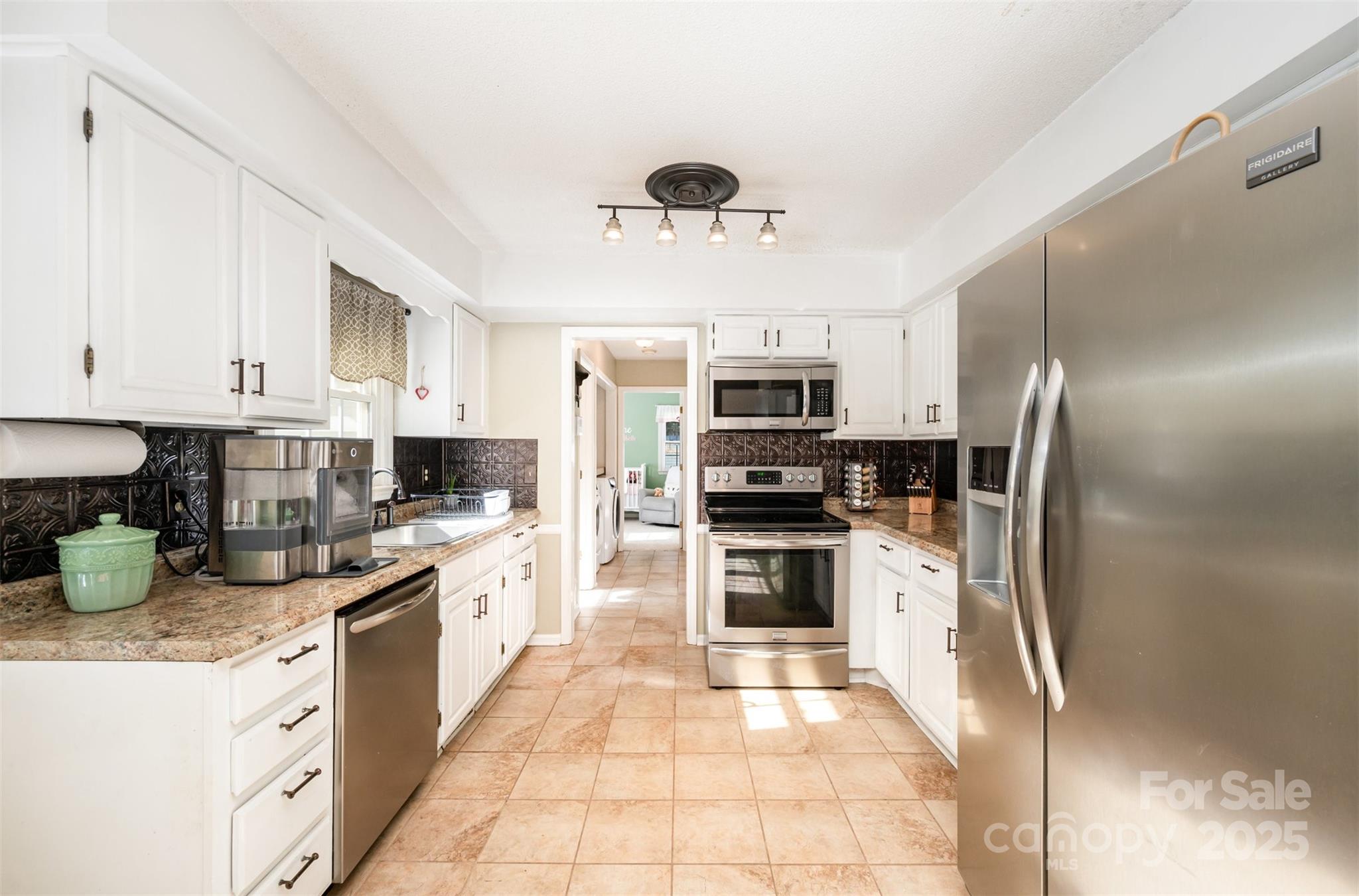 302 Nottingham Way Wadesboro, NC 28170 - Photo 4 of 30 a kitchen with stainless steel appliances granite countertop a refrigerator sink and stove