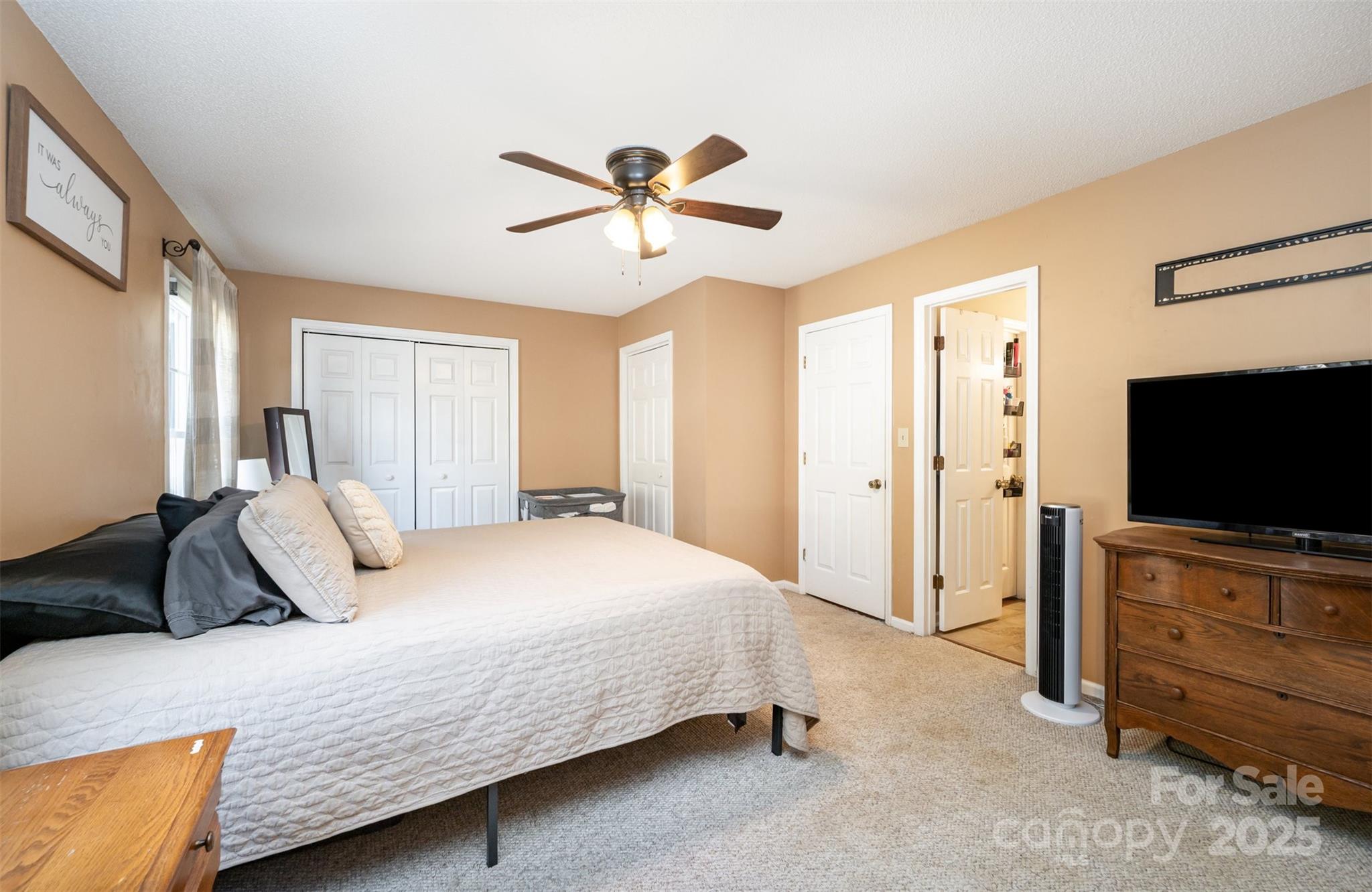 302 Nottingham Way Wadesboro, NC 28170 - Photo 5 of 30 a bedroom with a bed and a flat screen tv