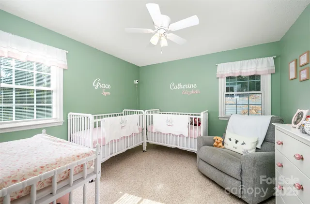 a living room with furniture and windows