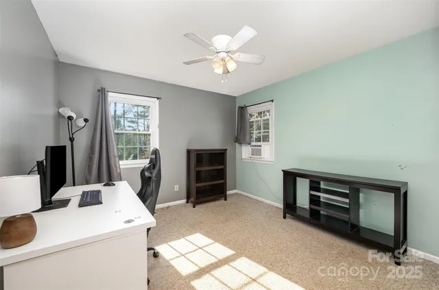 a view of kitchen with furniture and refrigerator