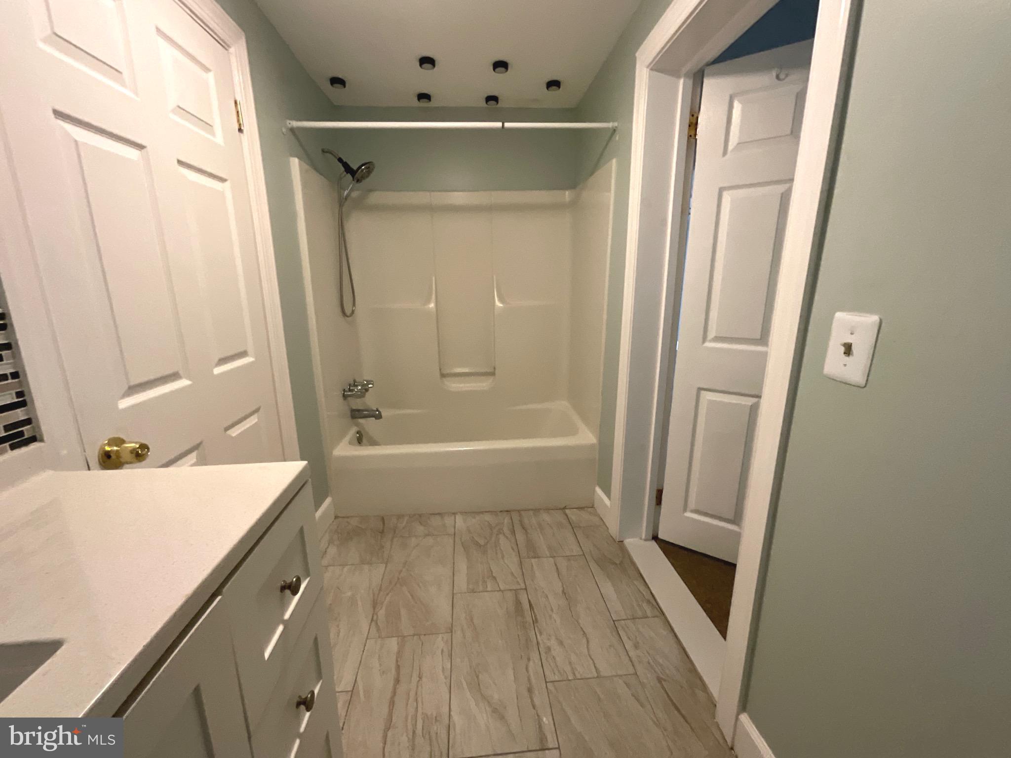 86 Kelley Road Fredericksburg, VA 22405 - Photo 21 of 36 a bathroom with a tub sink and mirror