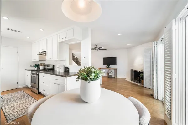 a kitchen with sink and refrigerator
