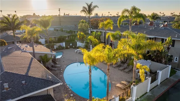 an aerial view of a house with a swimming pool