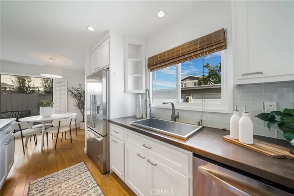 a kitchen with a sink and cabinets