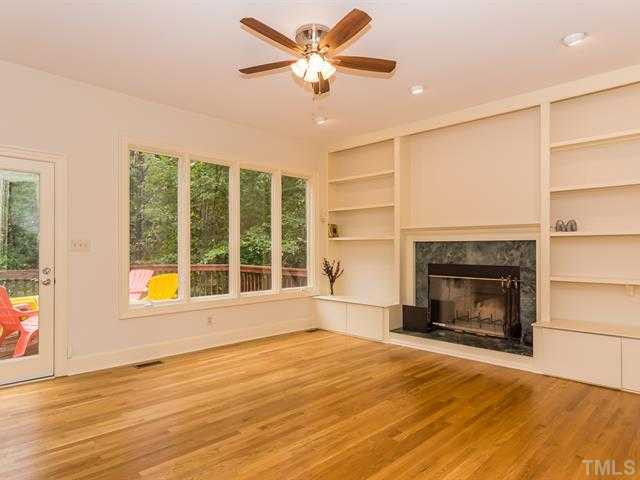 10108 Old Warden Road Raleigh, NC 27615 - Photo 8 of 25 The family room is very spacious with a wall of windows and built-ins flanking the fireplace! Den/Family/Great Room