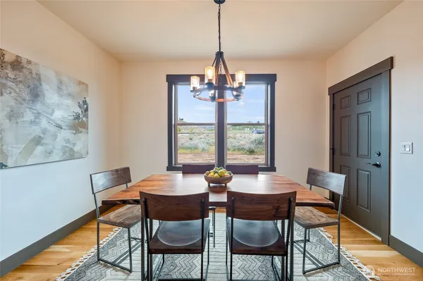 a dining room with furniture and window