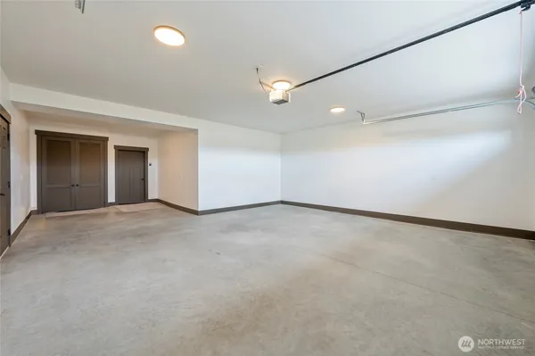 an empty room with a empty space and windows