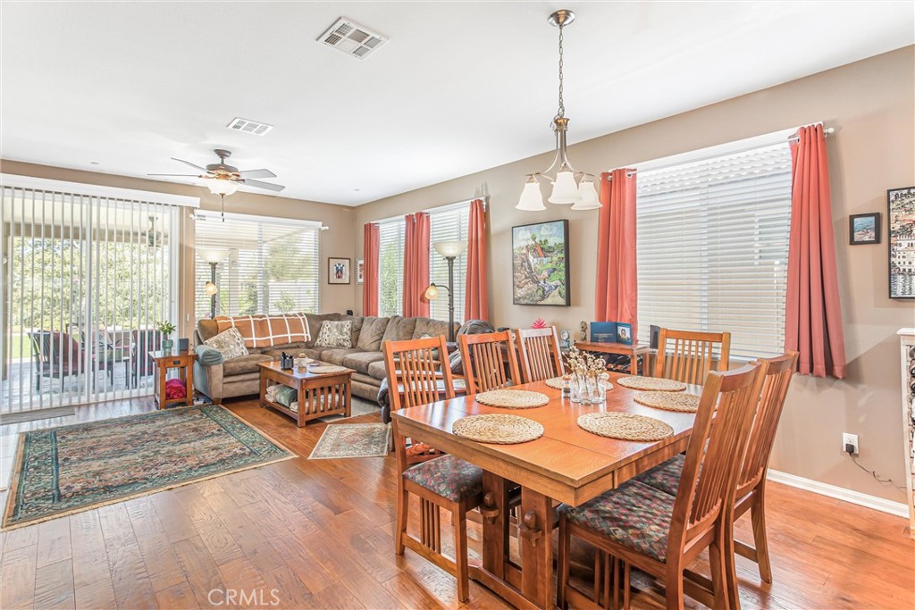 1476 Signal Peak Beaumont, CA 92223 - Photo 11 of 50 a dining room with furniture window and wooden floor